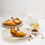 Twice-baked sweet potatoes with pecan toping on a plate.