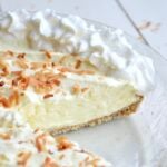 Close up of sliced coconut cream pie