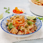 Lightened-up Jambalaya in a dish with a fresh lime wedge garnish.