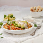 Southwest Egg Roll in a Bowl topped with fresh avocado and a creamy dressing.