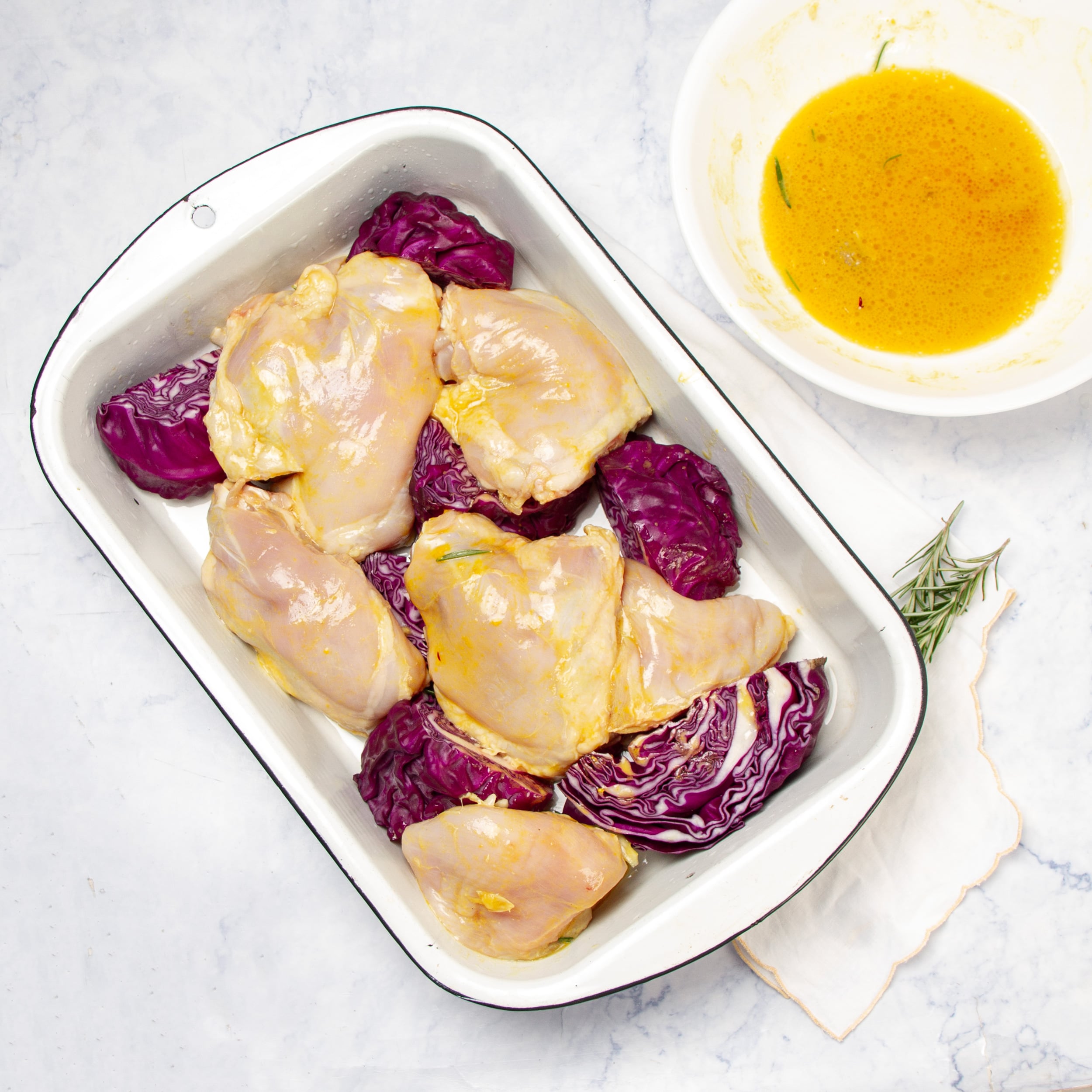 Chicken and cabbage layered in a baking dish. 