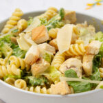 Healthy and delicious Chicken Caesar Pasta Salad in a bowl—just in time for summer!