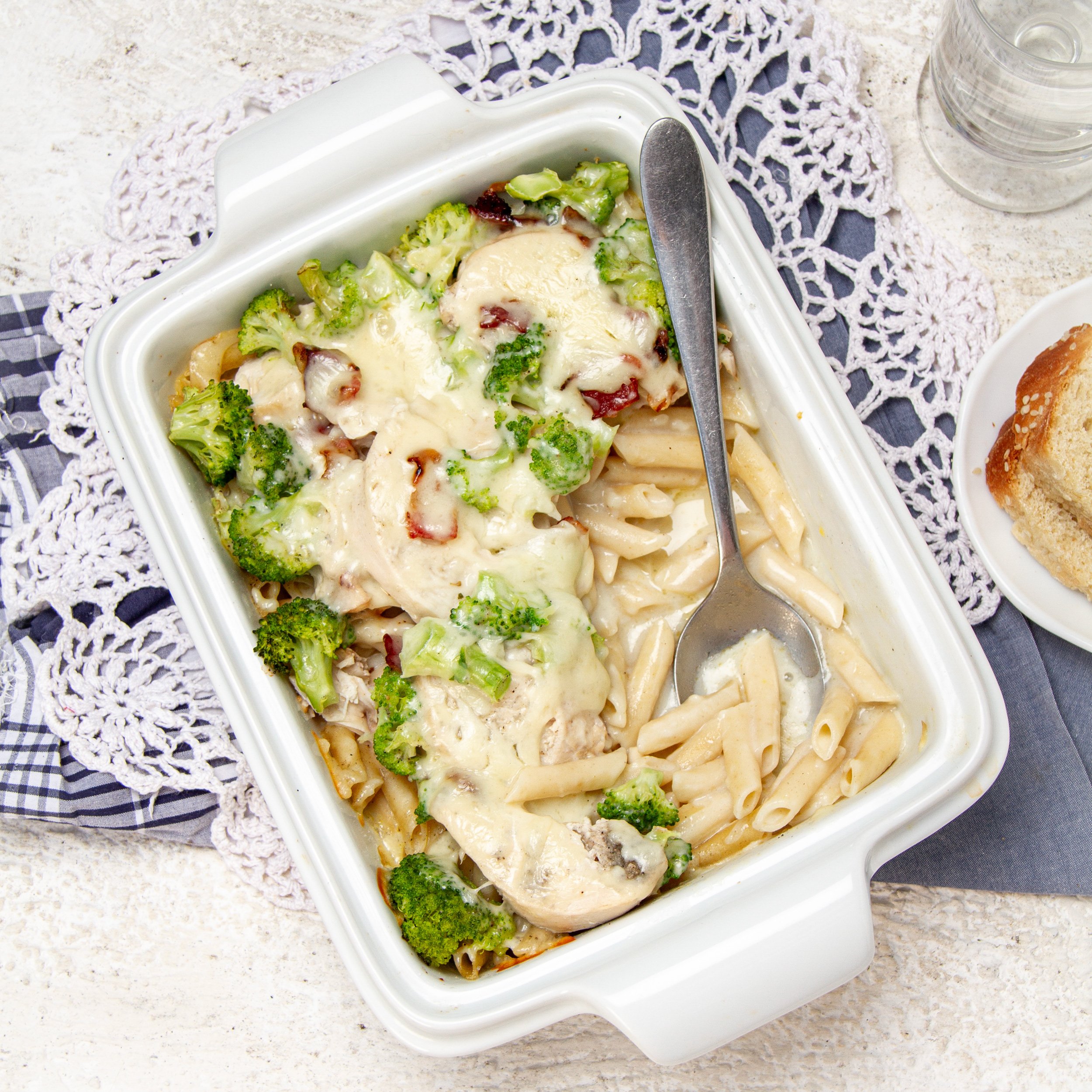 Rich, creamy, and satisfying—Chicken bacon alfredo pasta bake in a casserole dish, ready for eating!