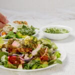 Healthy and vibrant Pesto Chicken and Avocado on a plate.