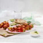 Bold, Asian-inspired Chicken Satay Skewers on a plate.