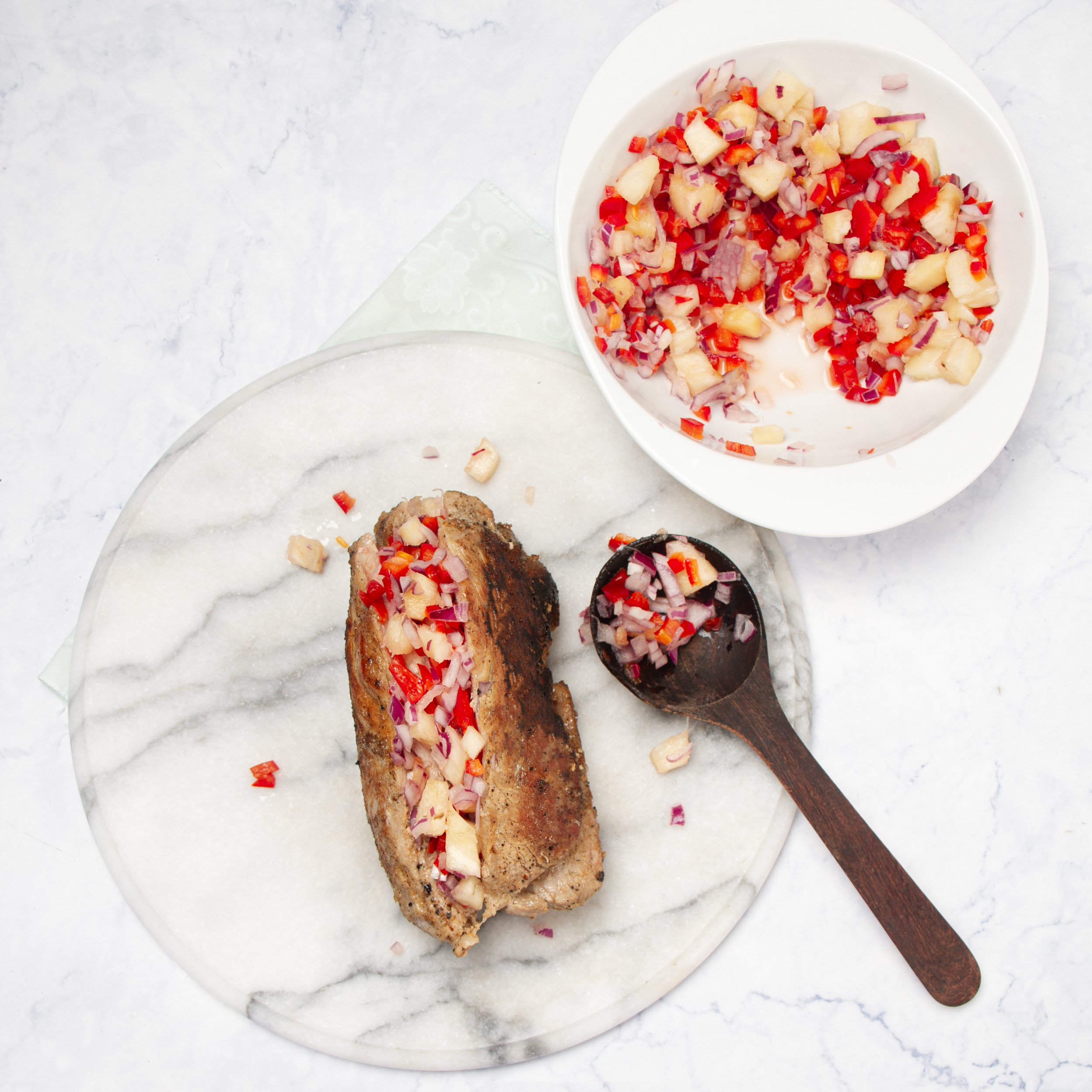 Pork tenderloin topped with pineapple salsa.