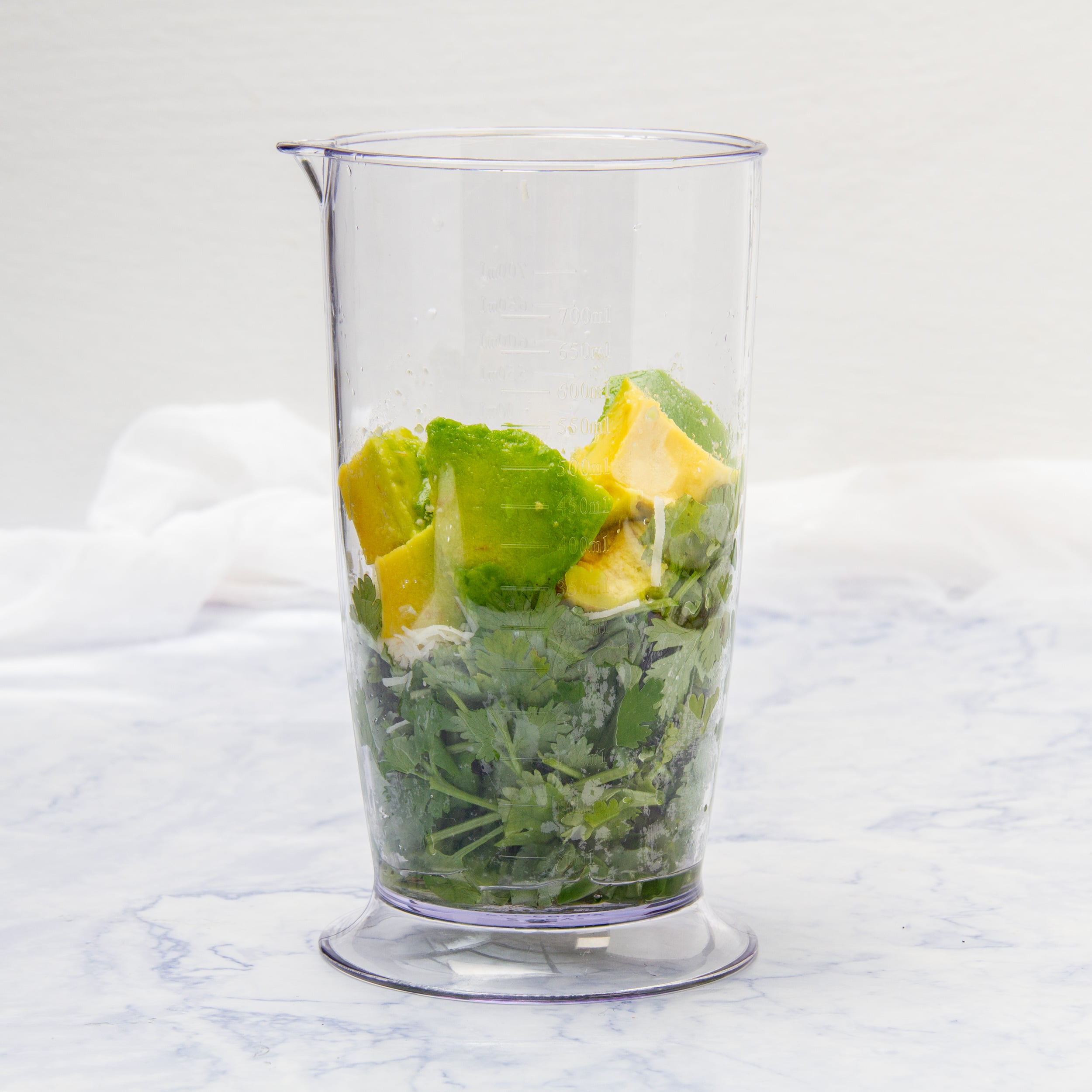 Prepped ingredients added to a food processor base. A blender works, too!