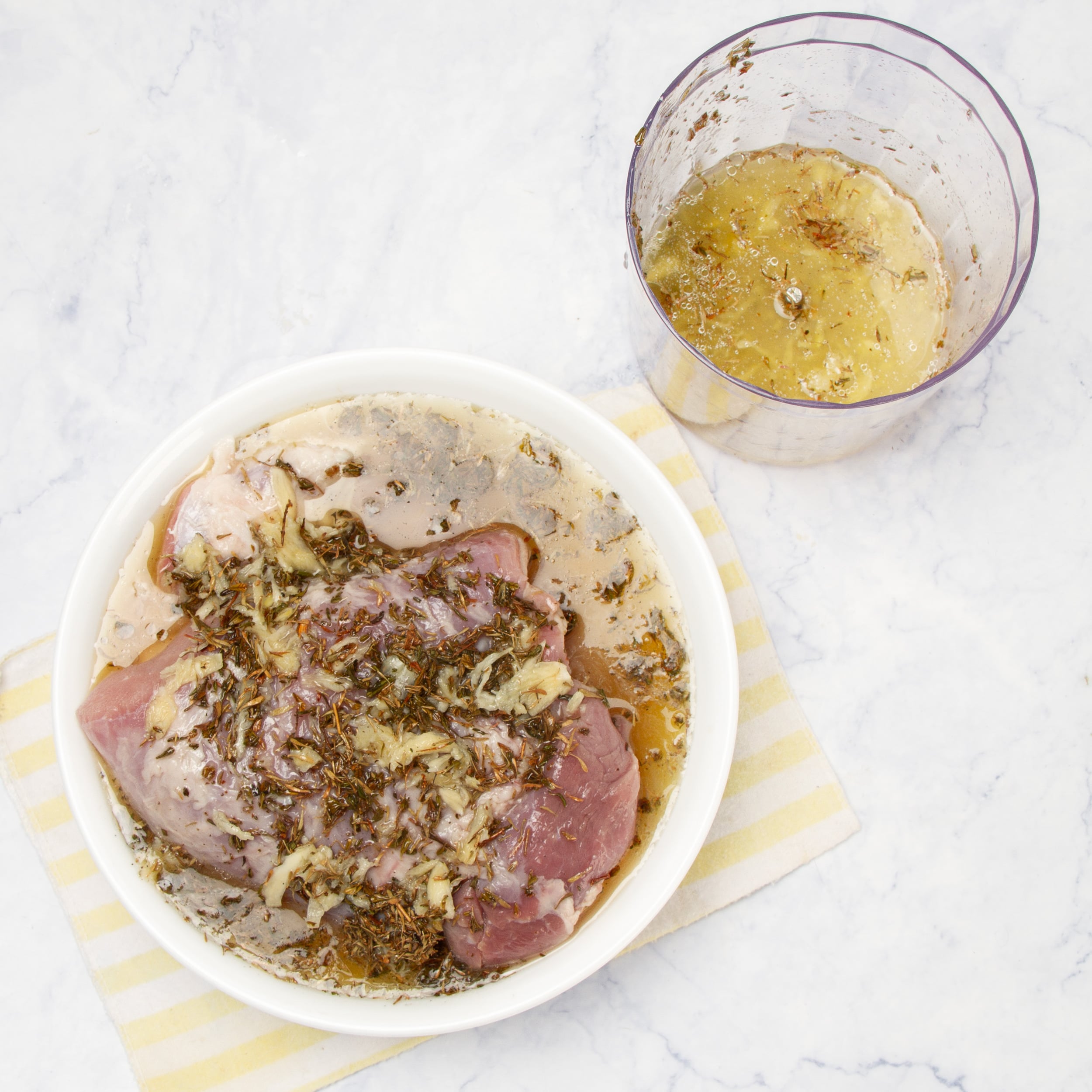 Pork marinating in a shallow dish. 