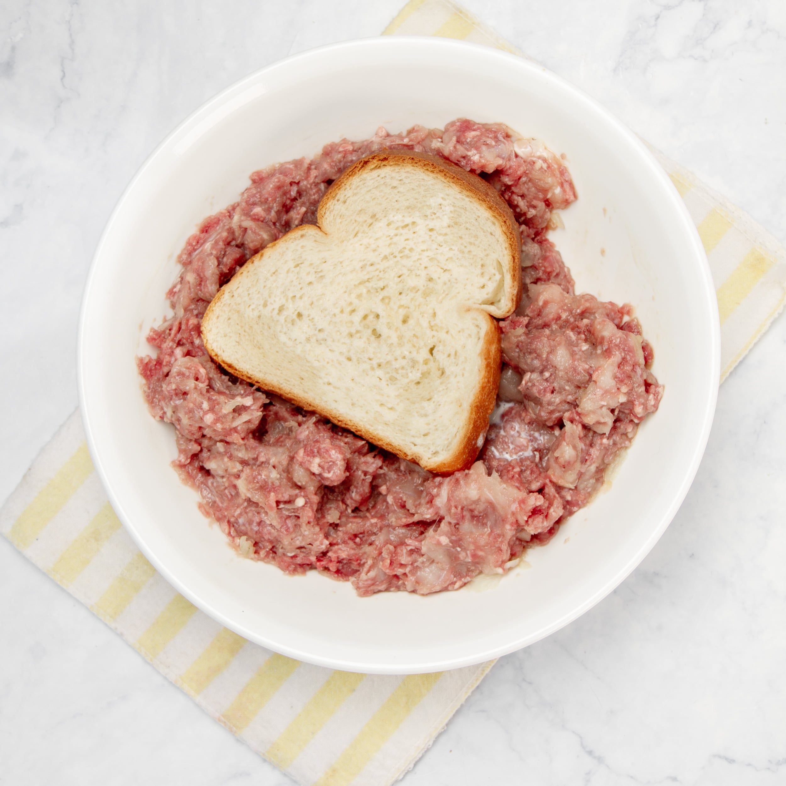 Softened bread placed in the seasoned meat to keep the meatballs tender. 