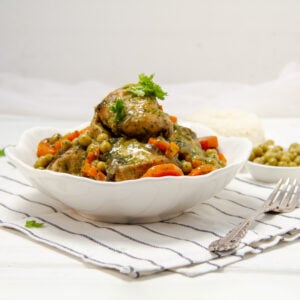 Seco de Pollo, a vibrant Ecuadorian-style chicken stew, piled high in a bowl.