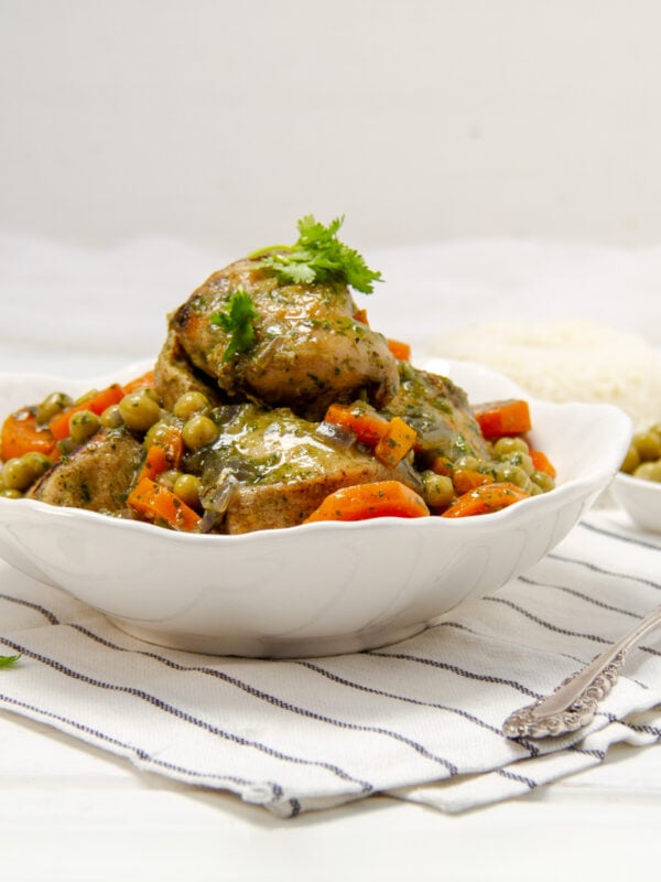 Seco de Pollo, a vibrant Ecuadorian-style chicken stew, piled high in a bowl.