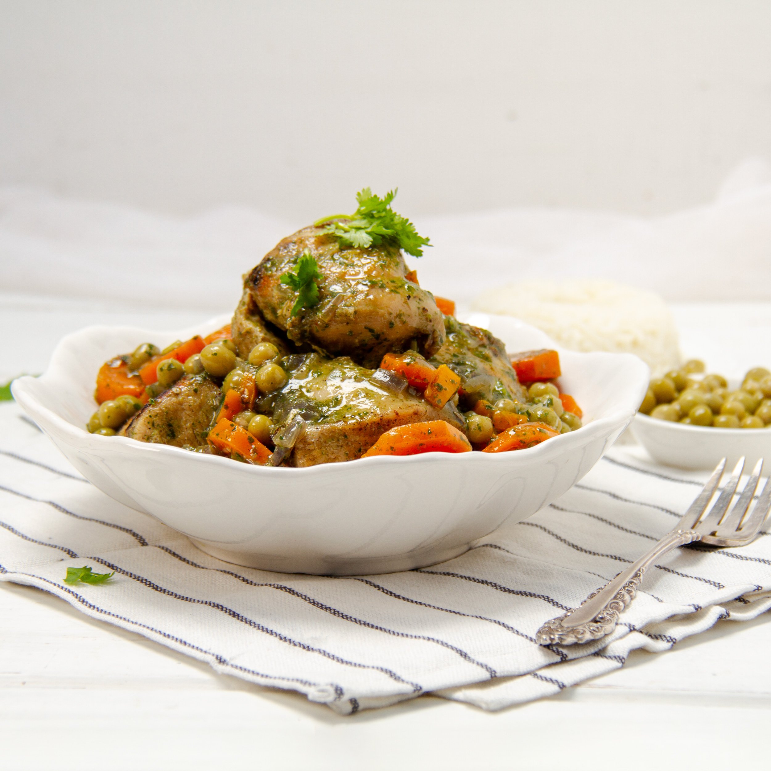 Seco de Pollo, a vibrant Ecuadorian-style chicken stew, piled high in a bowl.