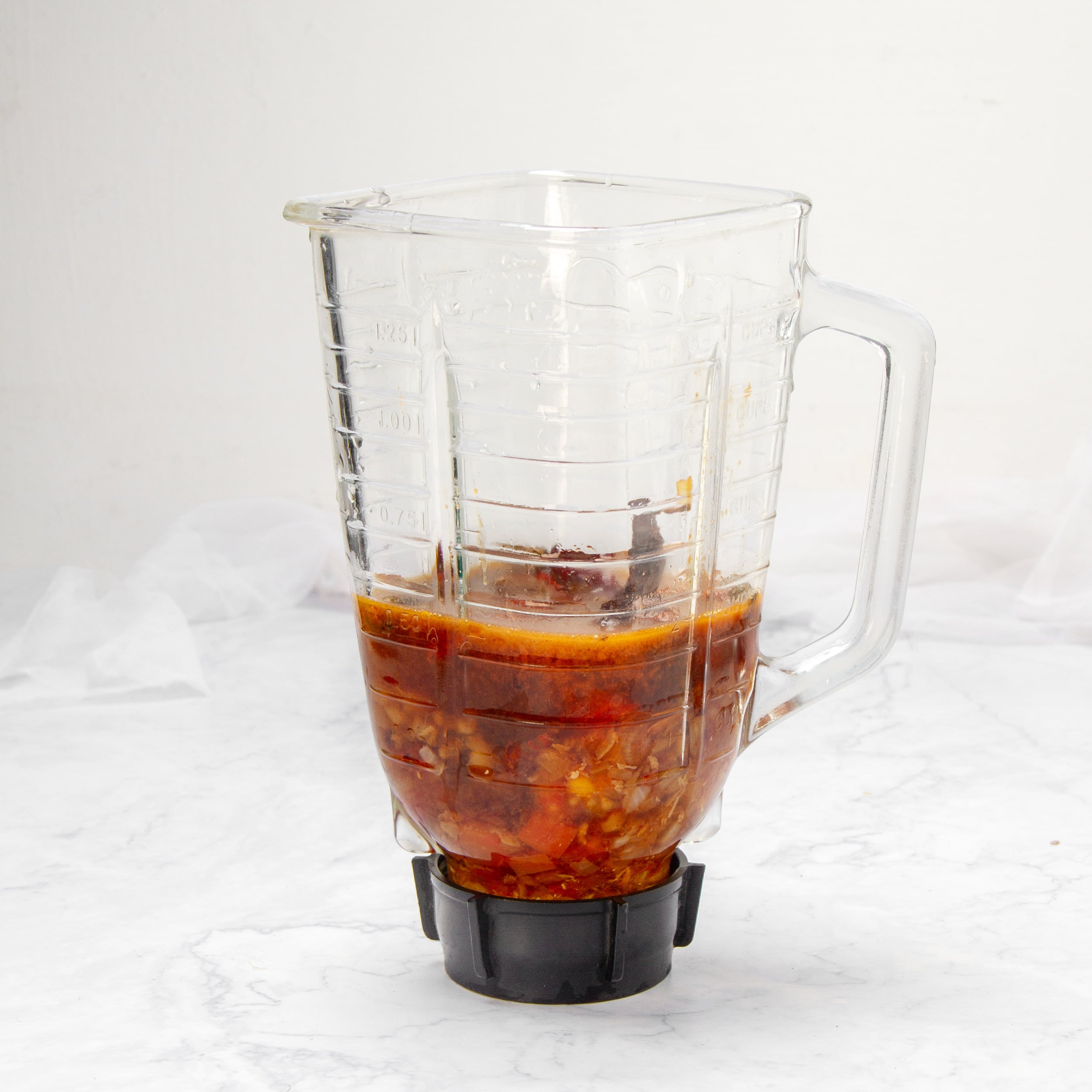 Sauce ingredients in a blender base. 