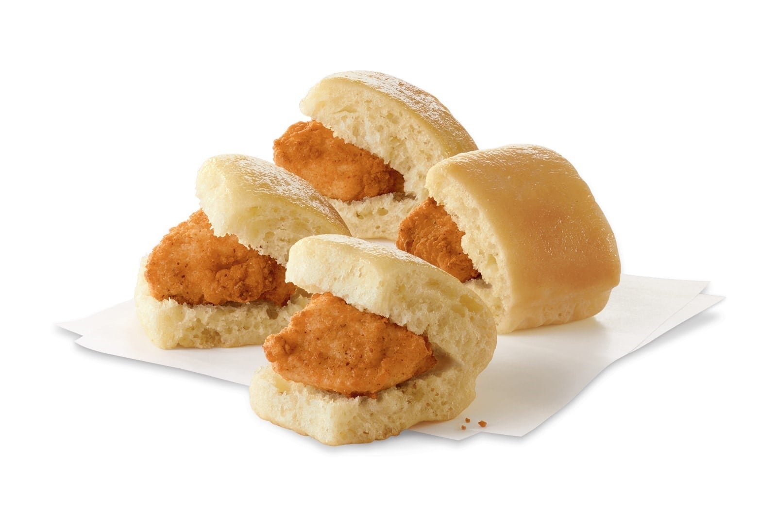 Four Chick-fil-A Chick-n-Minis, bite-sized breaded chicken nuggets in mini yeast rolls